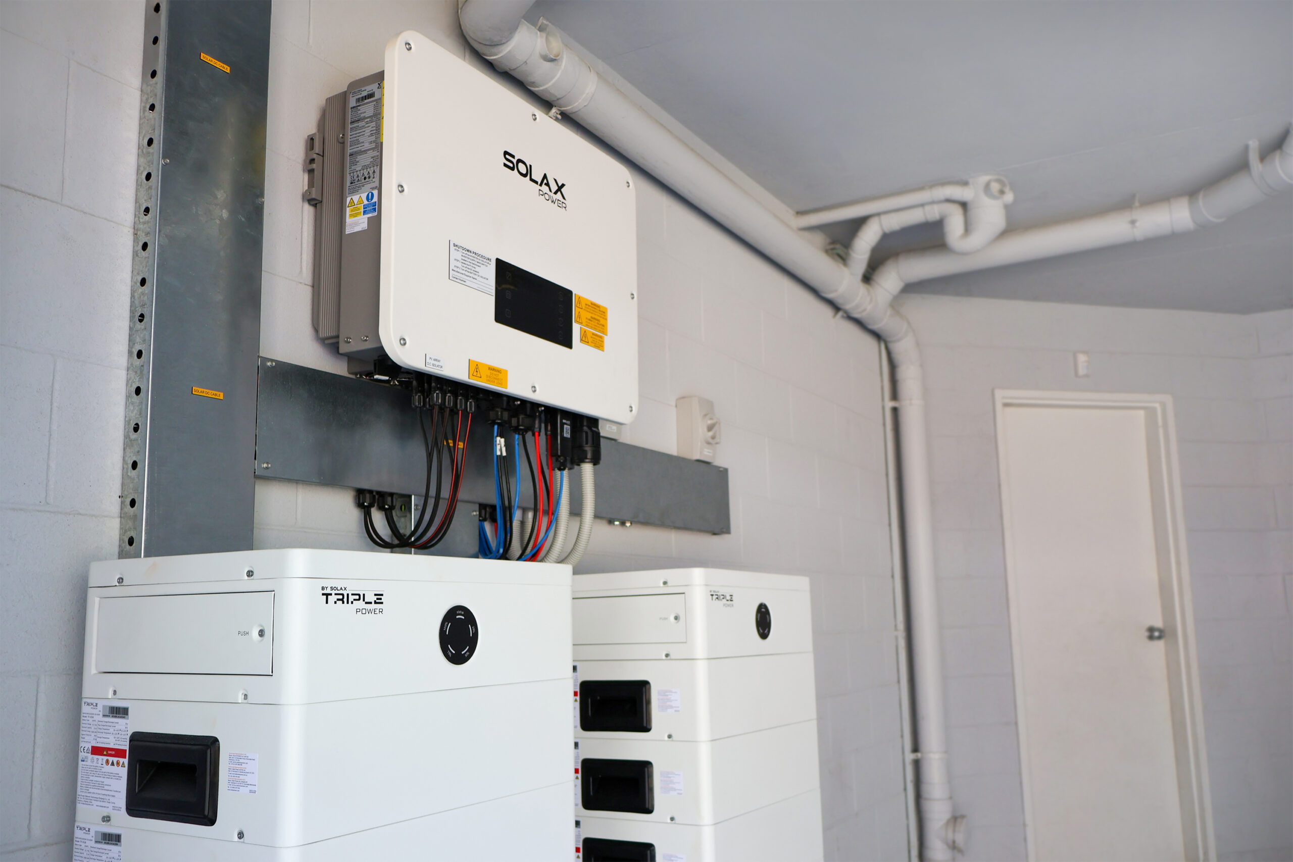 Meridien Energy team, located on the Gold Coast. The senior electrician and solar installers have completed a Home Power System. They have been working on a Nerang Queensland Home. The Meridien Energy team has installed a 25kW 3-Phase SolaX Hybrid Inverter and two 29.4kWh SolaX Battery stacks.